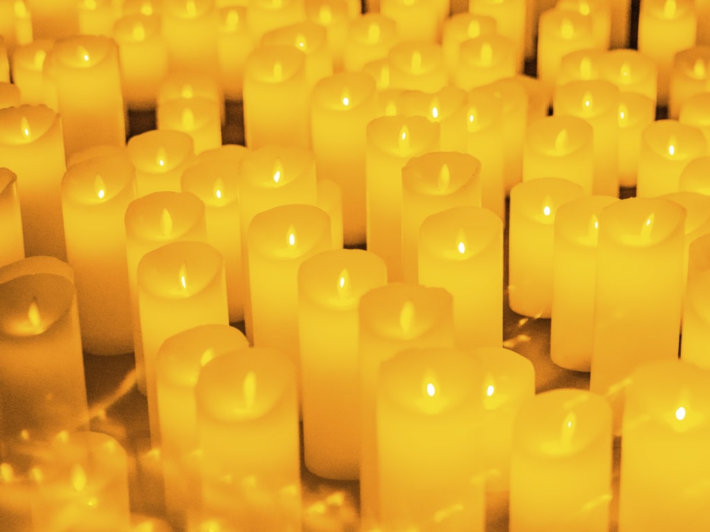 Rows of lit candles