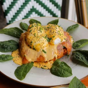 ﻿Eggs Benedict with drink at Mafrens