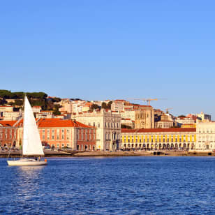 ﻿Sailboat trip around old Lisbon or at sunset