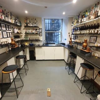Distill a bottle of gin on mini copper stills 1