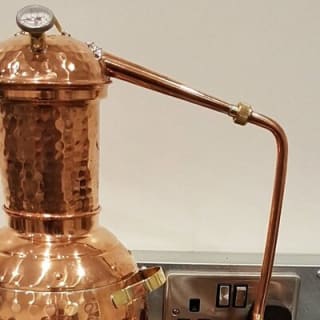 Distill a bottle of gin on mini copper stills 7