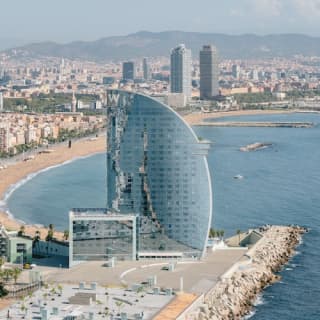 ﻿Helicopter flight over the Barcelona coastline