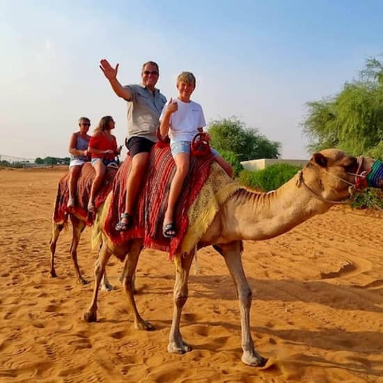 Camel Ride Safari in Red Dunes at Burj Khalifa Tower, Dubai, United Arab Emirates