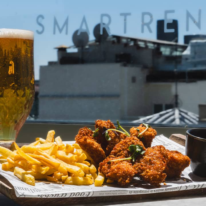 ﻿Two beers or wine and chicken fingers at Osadía Sky Bar